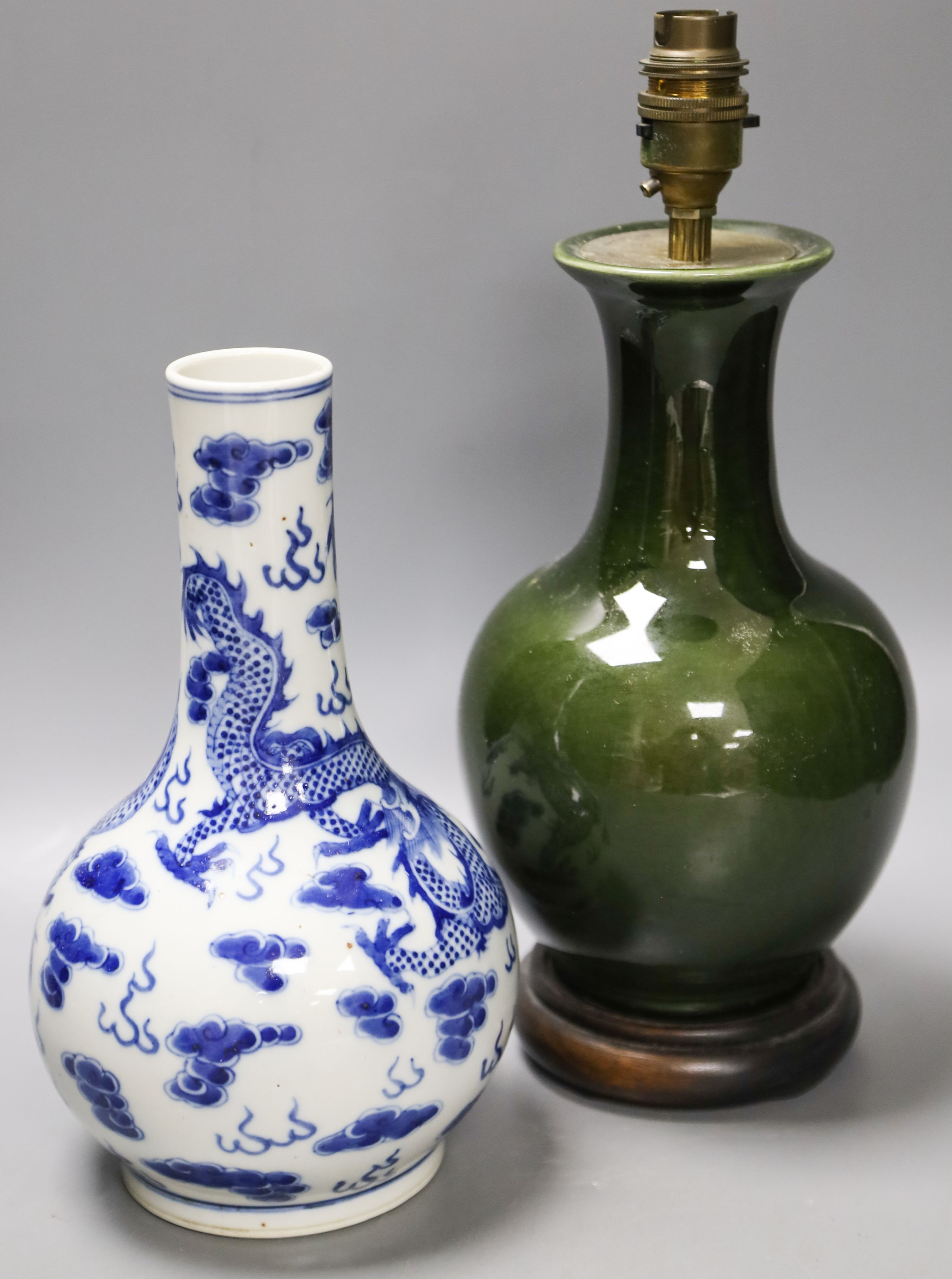 A Chinese blue and white dragon vase vase and Chinese green monochrome vase, mounted as a lamp 27cm